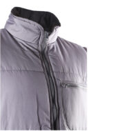 Close-up of a gray puffer jacket showing the front zipper and a zippered left-chest pocket.