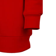 Close-up of a red sweatshirt sleeve with a ribbed cuff