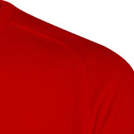 Close-up of a red knit sweater shoulder with visible seam.