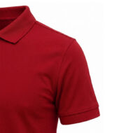 Red polo shirt with a collar and short sleeve, close-up on the shoulder and sleeve cuff emphasizing the fabric texture.