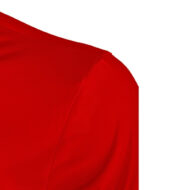 Close-up of red shirt shoulder with visible seam on a white background