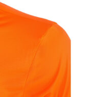 Close-up of bright orange fabric showing a shoulder seam of a t-shirt.