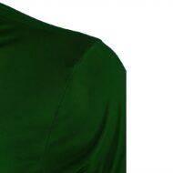 Close-up of a dark green fabric showing a shoulder seam on a garment.