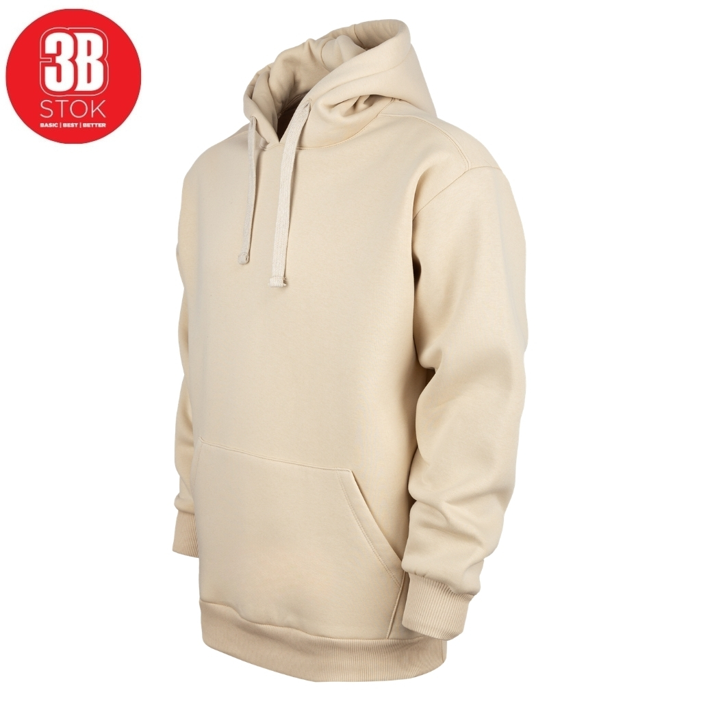 Beige hoodie with a front kangaroo pocket and drawstrings on a white background, shown from the side.