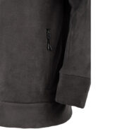 Close-up of a dark fleece jacket showing a vertical zippered pocket on the side and a gathered hem at the bottom.