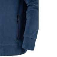 Close-up of a blue fleece jacket with a vertical zippered pocket.