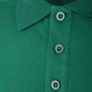 Close-up of a green polo shirt placket with round gray buttons and a collar edge visible.