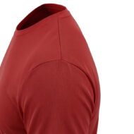 Close-up of a red T-shirt showing the shoulder seam and sleeve edge, focusing on fabric texture and stitching.