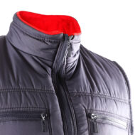 Dark quilted jacket close-up showing a red fleece lining and dual zippered chest pockets with raised collars.