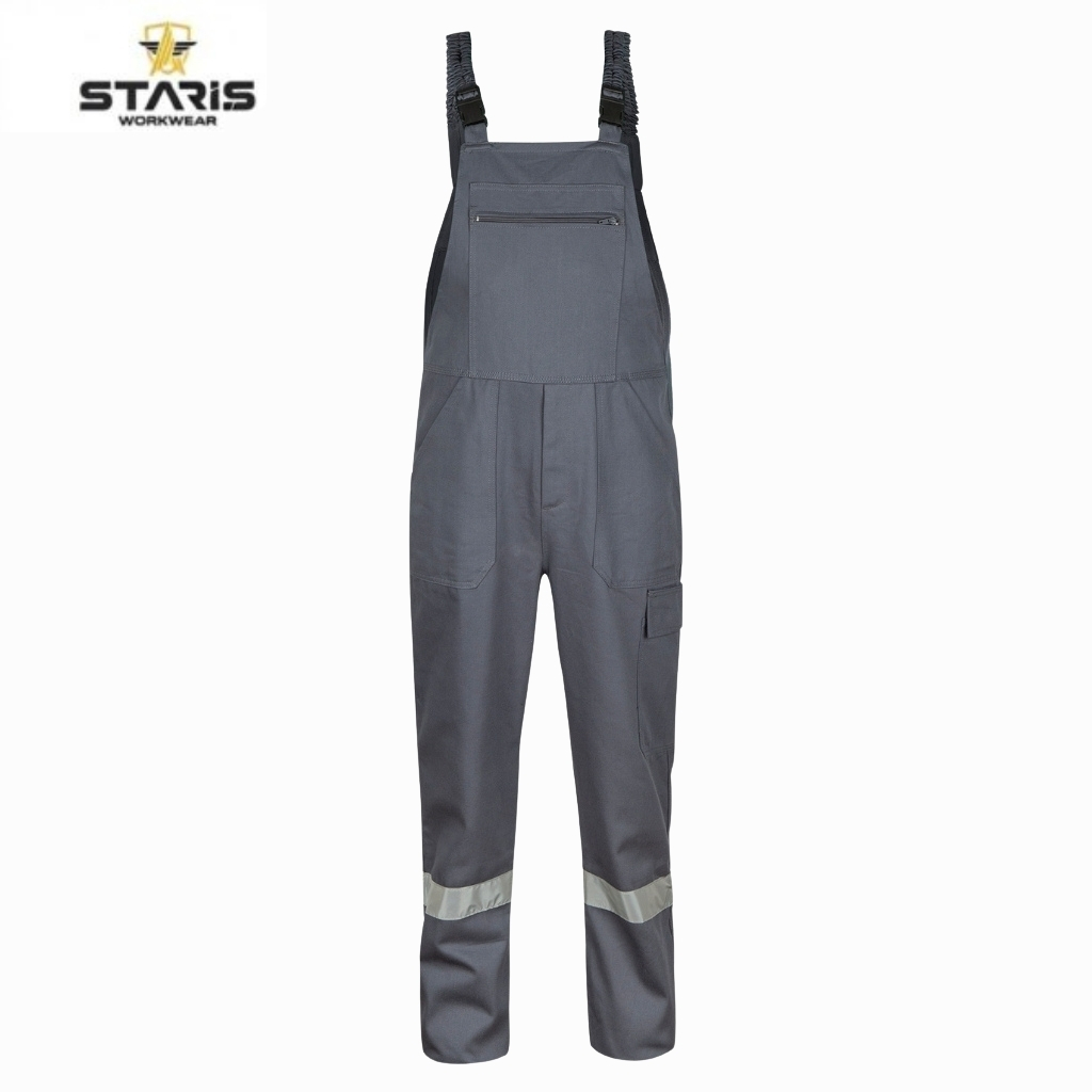 Grey work overalls with adjustable shoulder straps, front zip pocket, knee-access panels, and reflective band around lower legs; Staris Workwear logo in top-left corner