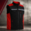 Black and red work vest with front zipper, multiple zip pockets and a reflective chest stripe on a gray industrial background.