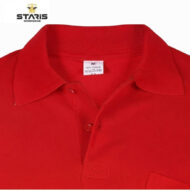 Red polo shirt close-up showing collar and placket with two buttons; Staris Workwear logo in corner.