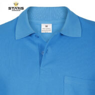 Close-up of a blue polo shirt collar with a two-button placket and chest pocket, Staris Workwear branding visible on the top left corner. Size tag shows M and material details on the inside label.