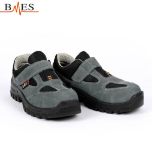 Pair of gray and black kids' sneakers with Velcro straps on a white background, BMES logo above left.