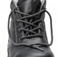 Close-up of black leather boot with braided laces threaded through metal eyelets and reinforced stitching.
