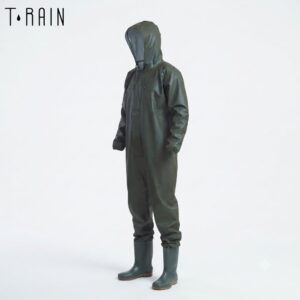 Person wearing a full olive-green rain suit with hood and matching rubber boots, standing against a light background (brand: T.RAIN).