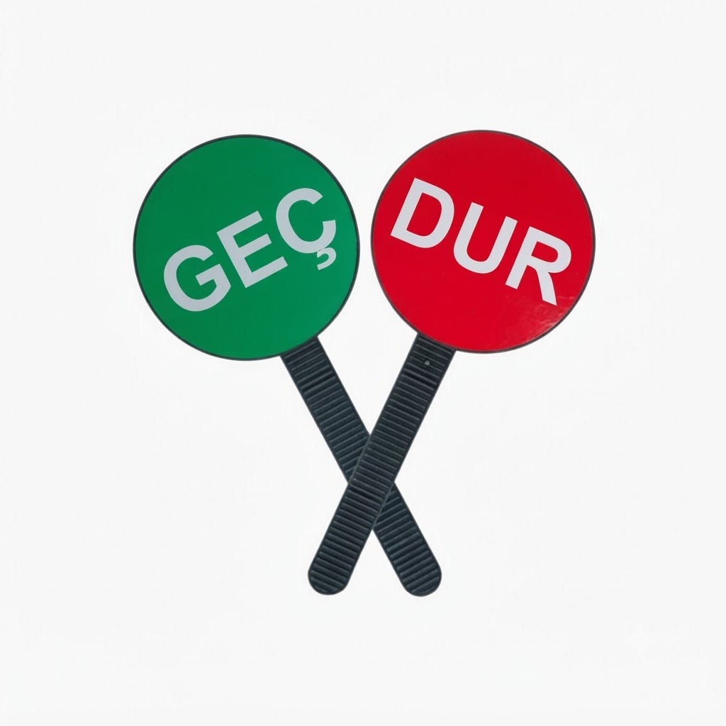 Two crossed black-handled circular signs: a green sign reading GEÇ and a red sign reading DUR.