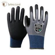Pair of black and gray safety gloves with blue knit cuffs, designed for hand protection in work environments, logo visible in corner (Safety Lord).