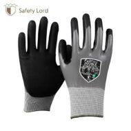 Pair of black and gray protective gloves with textured fingertips and knit cuffs, branding shows Safety Lord logo in the corner.