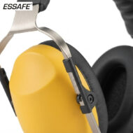 Close-up of yellow safety earmuffs with a metal headband, used for hearing protection in noisy environments (ESSAFE branded).