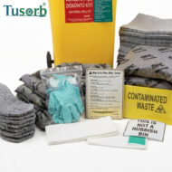 PPE kit with gloves and goggles, stacked towels, and a yellow contaminated-waste container; Tusorb logo visible