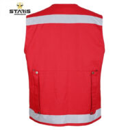 High-visibility red safety vest with white reflective stripes across the upper back and bottom edge, shown from the back (Staris Workwear).