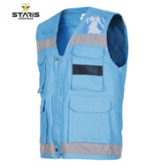 Blue sleeveless work vest with reflective gray stripes and multiple pockets.