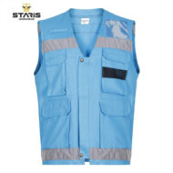 Blue work vest with multiple front pockets, gray reflective trim on the chest and hem, and a black mesh pocket; STARIS Workwear logo in the corner
