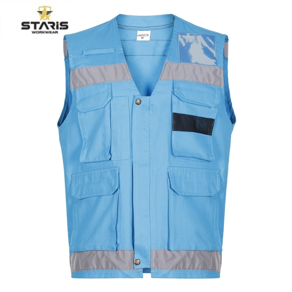 Blue work vest with multiple front pockets, gray reflective trim on the chest and hem, and a black mesh pocket; STARIS Workwear logo in the corner