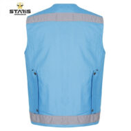 Blue work vest viewed from the back, with a gray reflective strip across the shoulders and bottom hem, branded Staris Workwear on the top left