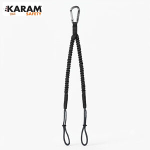 KARAM Safety logo in the top left with a black braided safety lanyard featuring a metal carabiner and two bottom loops against a white background; used for fall protection gear.