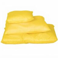 Pile of yellow pillows stacked on a white background with a duvet at the bottom