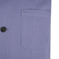 Close-up of a lavender blazer pocket with top-stitching and a dark button nearby.