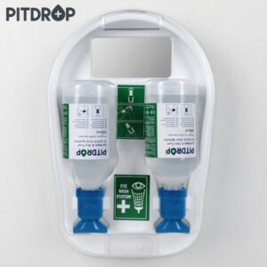 Dual bottle eye wash station mounted on a white wall panel with instructional labels and blue nozzles