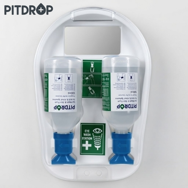 Dual bottle eye wash station mounted on a white wall panel with instructional labels and blue nozzles