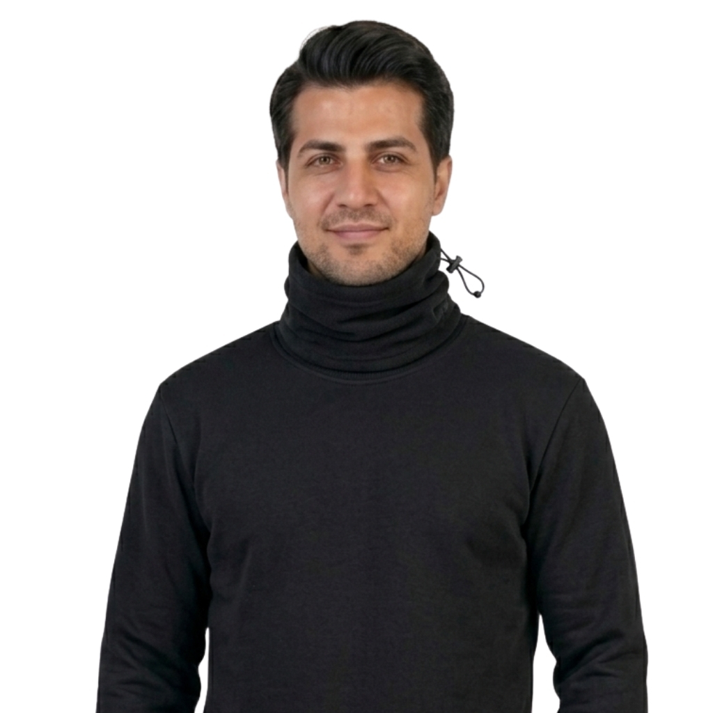 Portrait of a man in a black turtleneck with a drawstring, standing against a white background, looking at the camera.