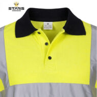 Front view of a high-visibility safety polo: bright yellow torso, gray sleeves, black collar, reflective trim, Staris Workwear logo in corner.