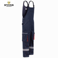 Dark blue coverall with adjustable shoulder straps, multiple pockets, and reflective stripes at cuffs; Stanis Workwear.
