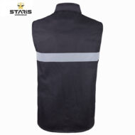 Back view of a dark work vest with a light gray reflective band across the upper back (Staris Workwear logo visible).
