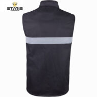 Back view of a dark navy work vest with a horizontal light-gray reflective stripe across the mid-back; Staris logo visible in the top-left corner