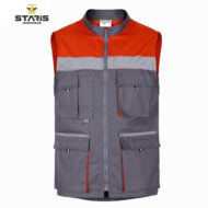 Grey and orange Staris workwear vest with multiple front pockets and a central zipper, industrial utility design.