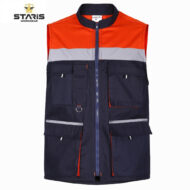 Navy blue work vest with orange upper section, light gray reflective stripe, and multiple pockets with zippers.