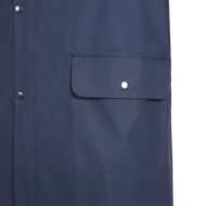 Dark blue jacket pocket with a flap and metal snap button on a clean seam detail