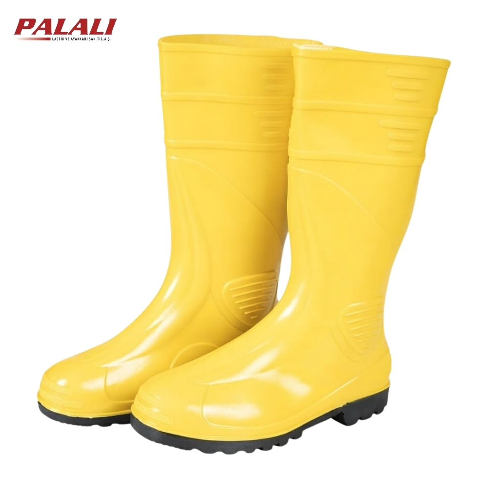 Pair of bright yellow rubber rain boots with black tread soles, shown side by side.