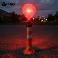 Portable orange traffic safety beacon with a red light on a striped stand, set on a road at dusk; Evolux Tech logo in the top-left corner.