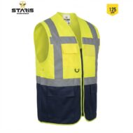 High‑visibility safety vest in neon yellow with reflective silver bands and navy lower pockets, front zipper, multiple pockets, designed for construction/work sites.