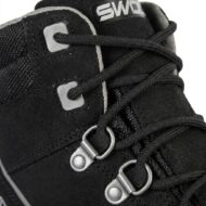 Close-up of a black hiking boot showing laces, metal eyelets, and stitching details.