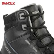 Close-up of a black safety boot with padded ankle, leather upper, and laces; brand SWOLX Safety Footwear visible in the corner.