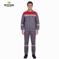Man in gray workwear with a red chest panel and reflective gray stripes, standing in front of a white background; Staris Workwear logo in the top-left corner.