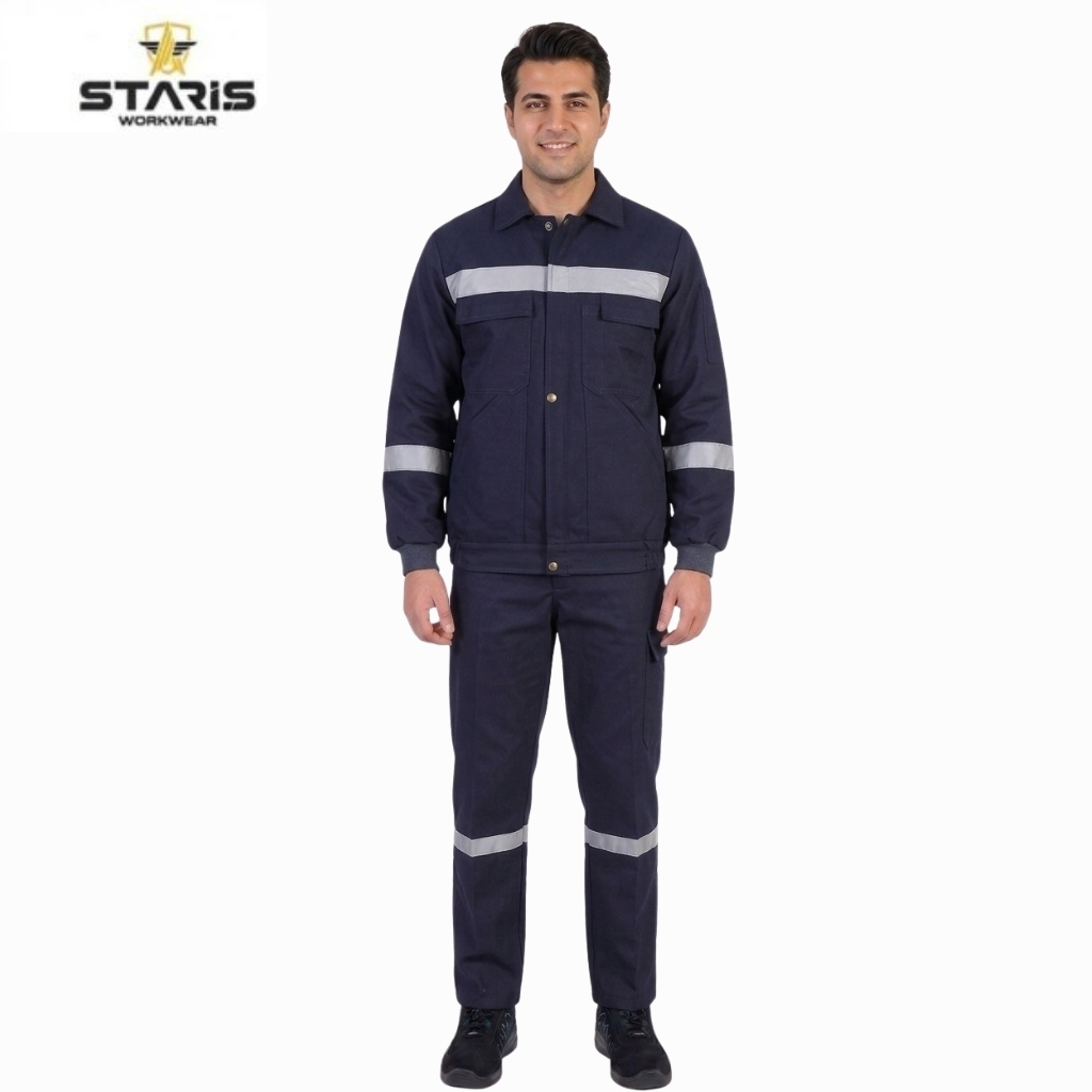 Man wearing navy blue workwear jacket and pants with reflective bands on chest, sleeves, and legs, standing against a white background.